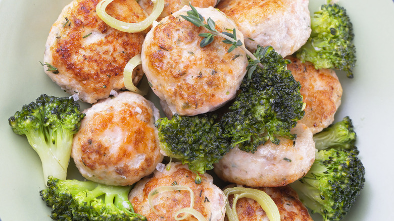 Plate of salmon meatballs and broccoli