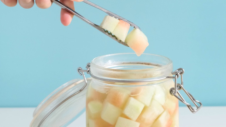 Pickled watermelon rinds in a jar