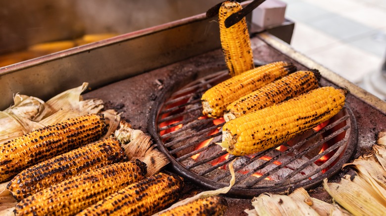 Husked corn on a grill