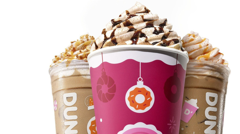 The Dunkin' holiday drinks in front of white background