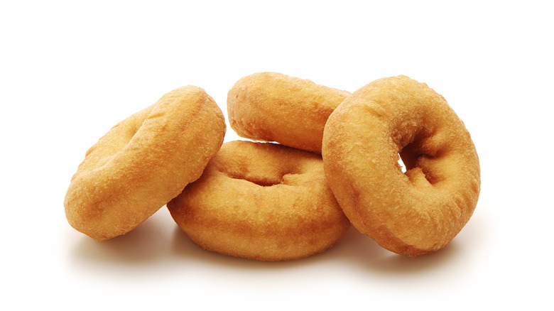 four stacked plain donuts