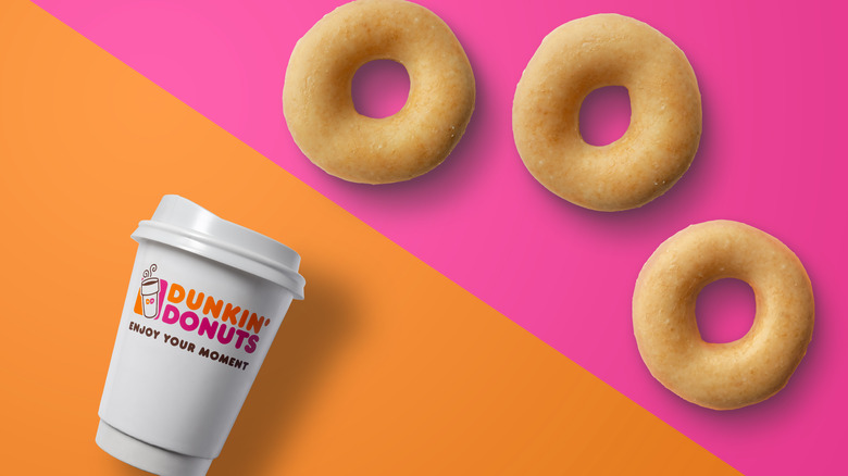 A Dunkin' cup next to Dunkin' Donuts