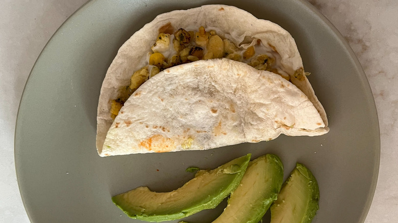 Dunkin' Breakfast Taco with sliced avocado