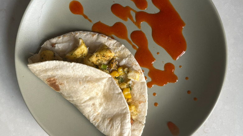 Dunkin' Breakfast Taco with hot sauce