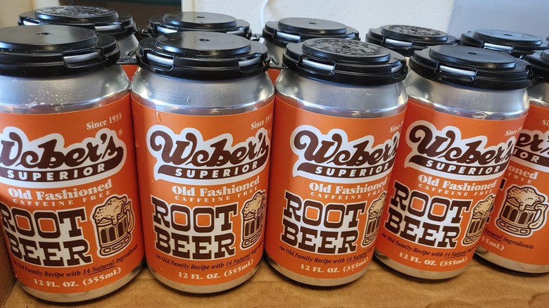 Cans of Weber Superior Root Beer