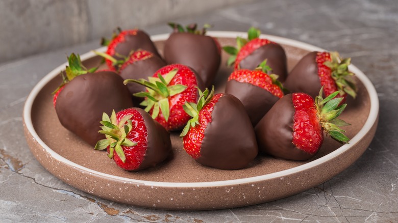 Plate of strawberries dipped in chocolate