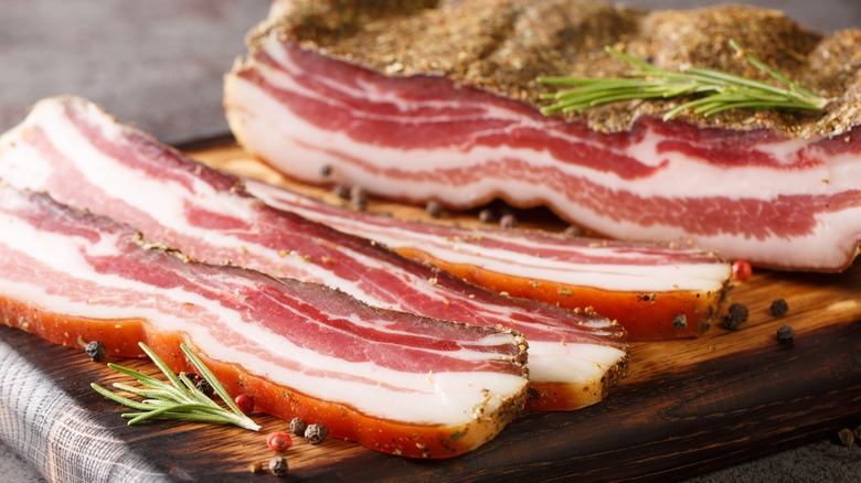 sliced pancetta on cutting board