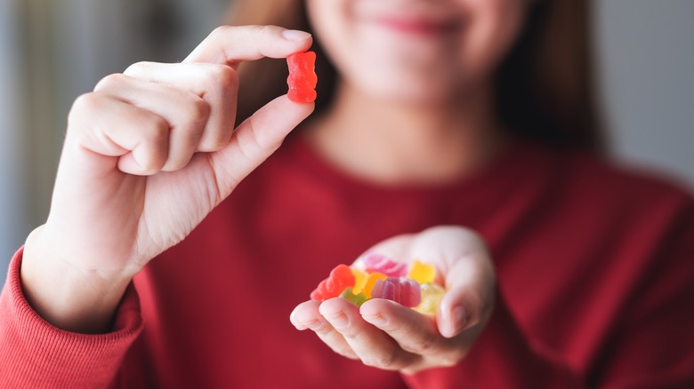 Woman holding gummy bear