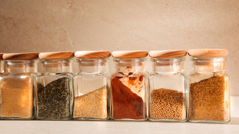 Various spices in glass jars