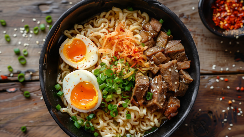 bowl of ramen with beef, egg, and green onion