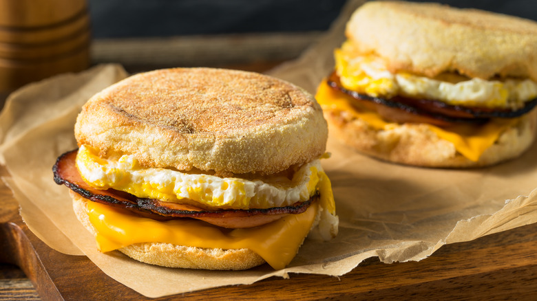 breakfast sandwiches on wooden board