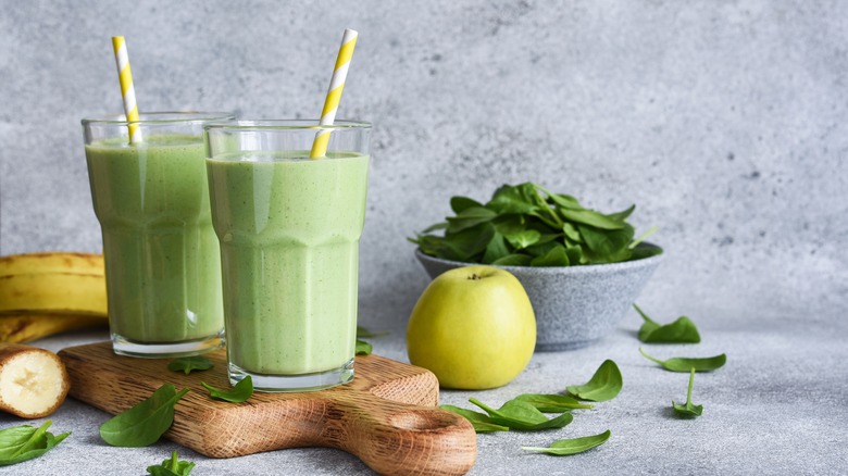 green smoothies on wooden board