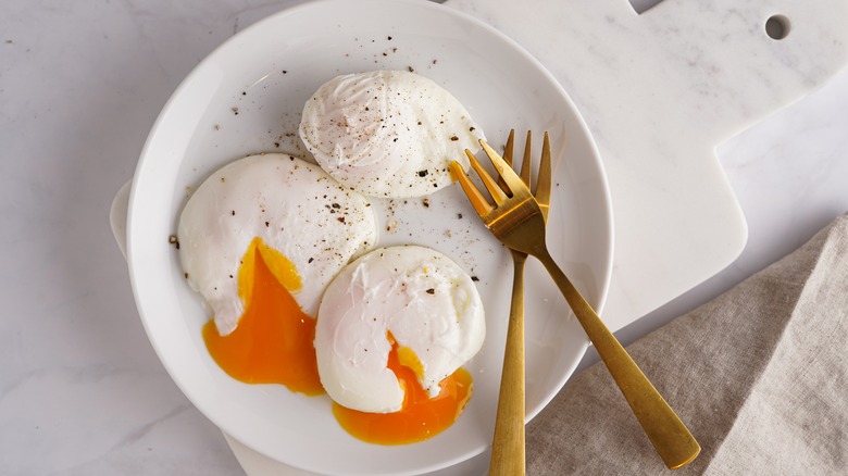 poached eggs on plate 