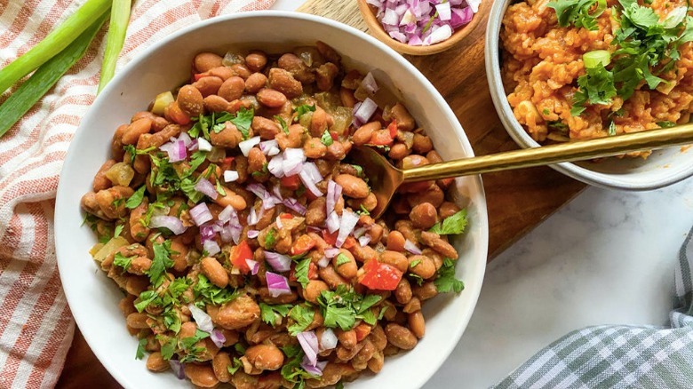 pinto beans topped with cilantro and onion