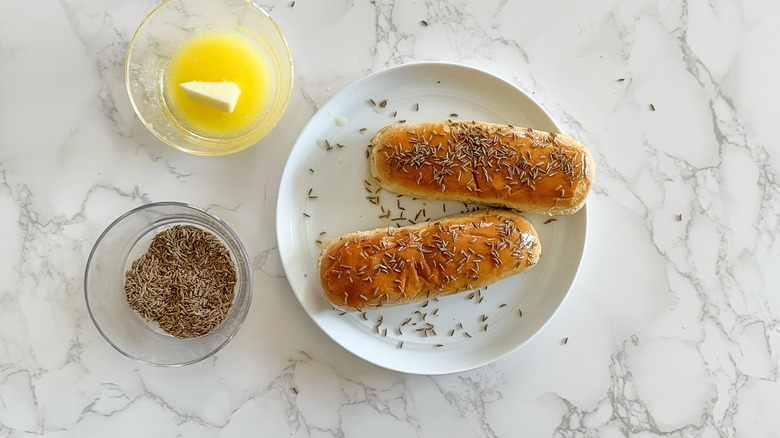 melted butter caraway seeds on hot dog buns