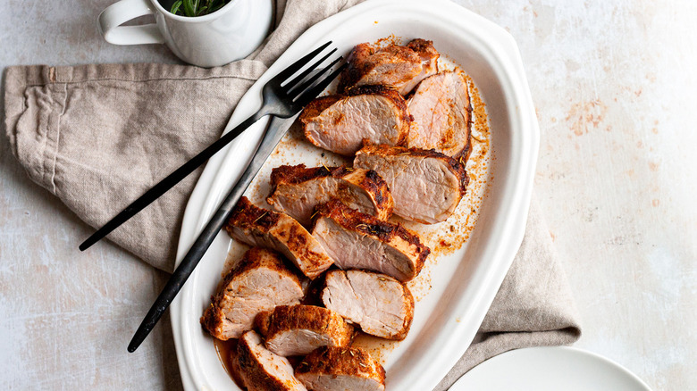 sliced pork tenderloin on platter