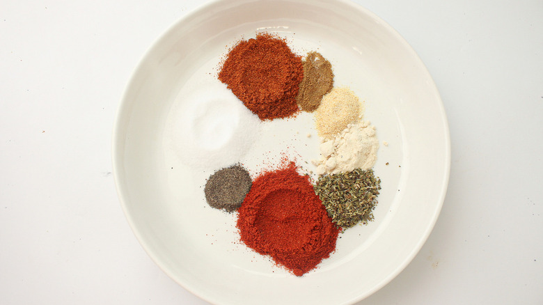 several spice piles on plate