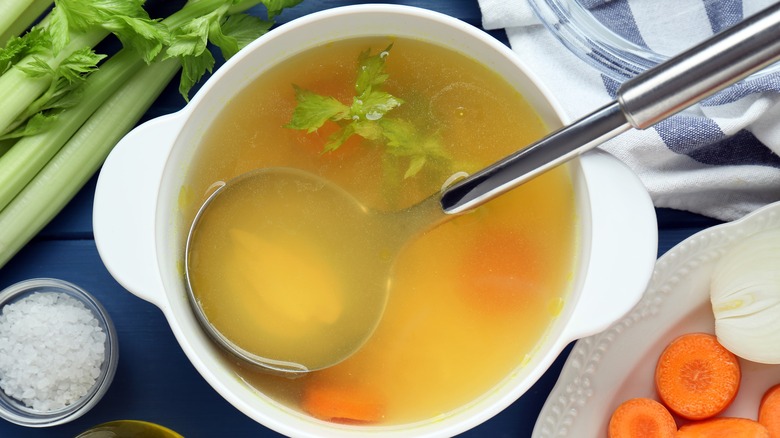 Broth in bowl with vegetables