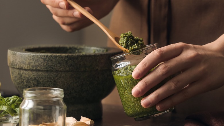 woman making pesto