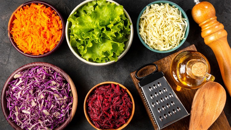 Shredded vegetables in separate bowls 