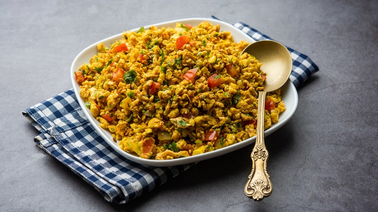 plate of egg bhurji with a spoon