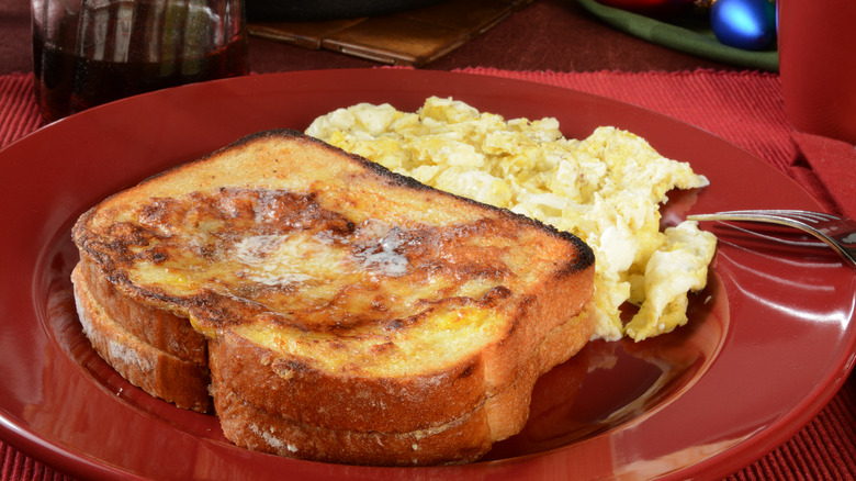 French toast and eggs on plate