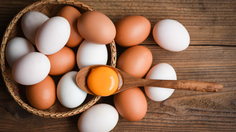 Basket full of white and brown eggs 