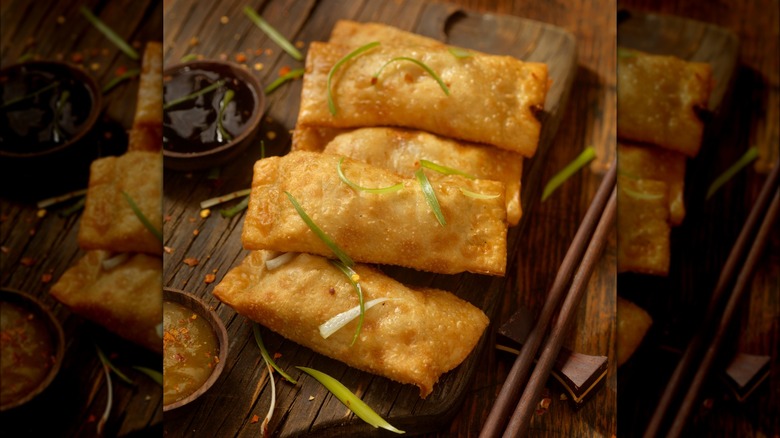 Egg rolls on wooden board