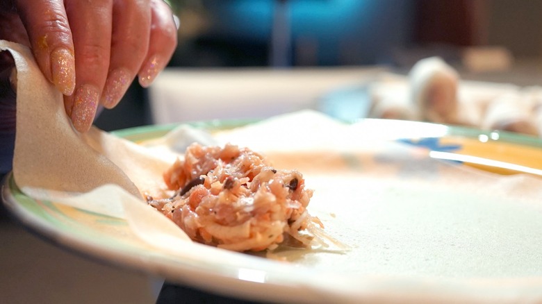 Making egg rolls on plate