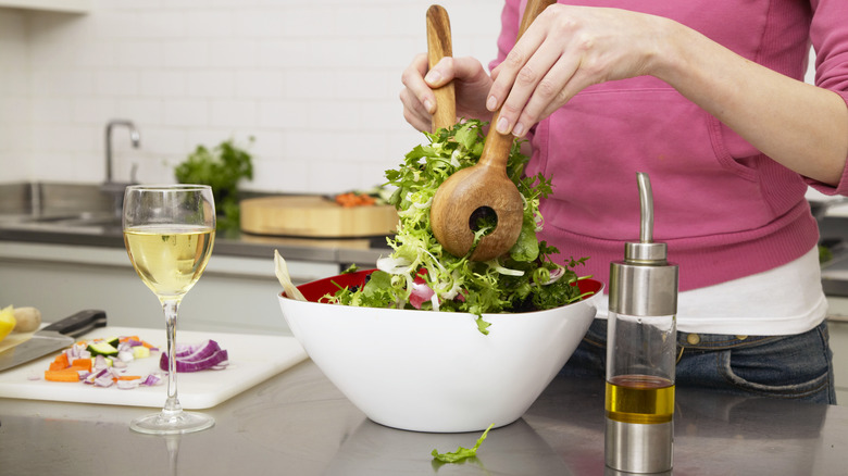 Glass of wine and bowl of salad