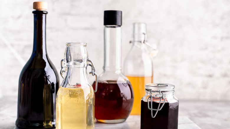 Bottles and jars of different wine vinegars