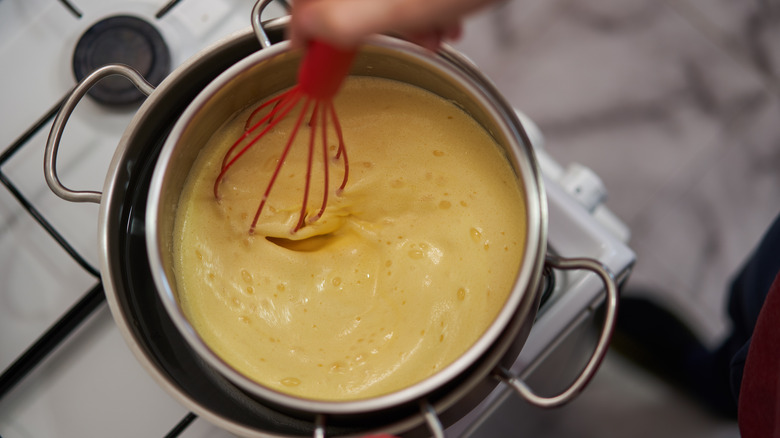 whisking crème brûlée custard