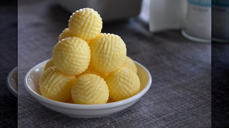 Plated butter balls on dish