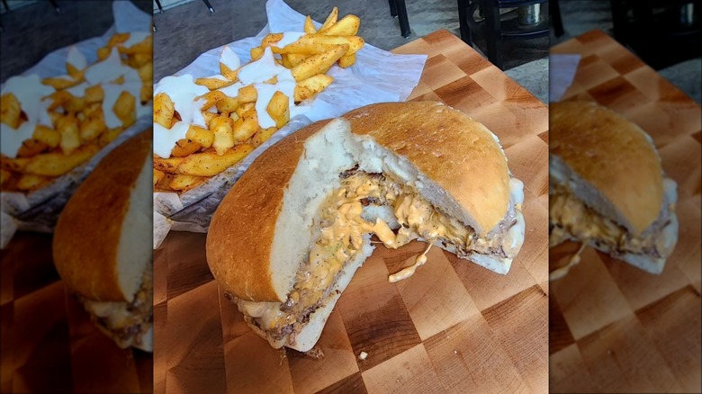 Cheeseburger with fries on board