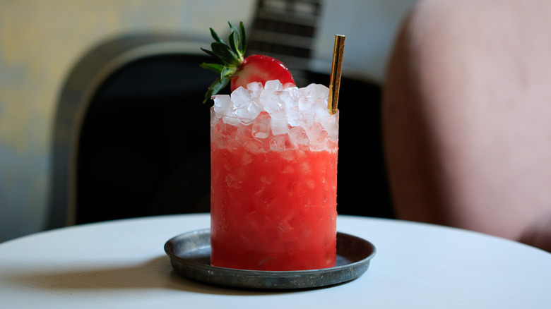 Pink cocktail with pebble ice 