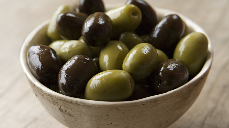 Bowl of green and black olives