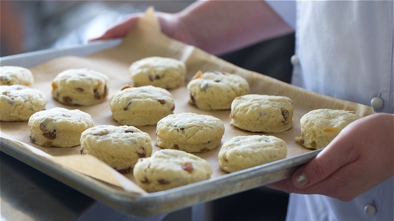 Raw scones on baking sheet 