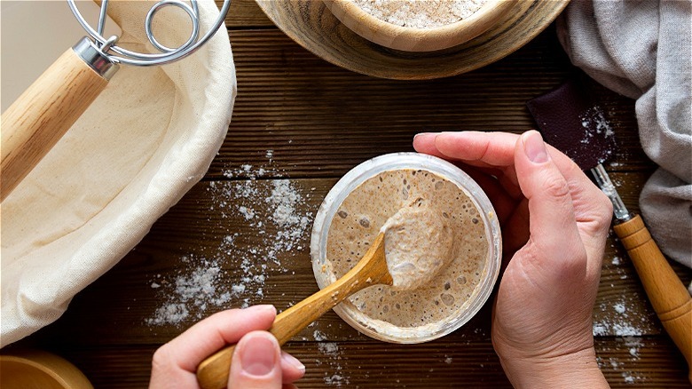 Hand stirring sourdough starter 