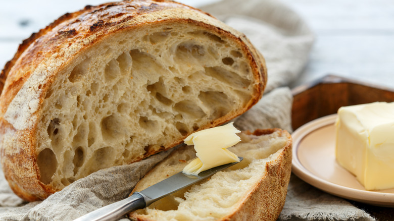 sliced sourdough with butter knife