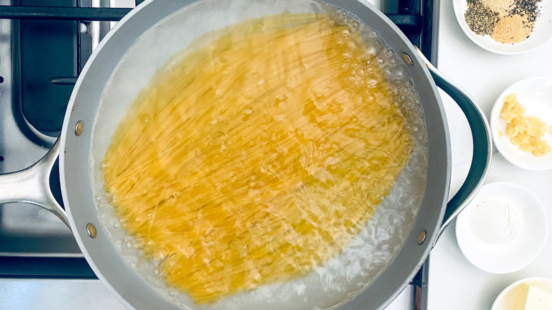 spaghetti boiling in pot