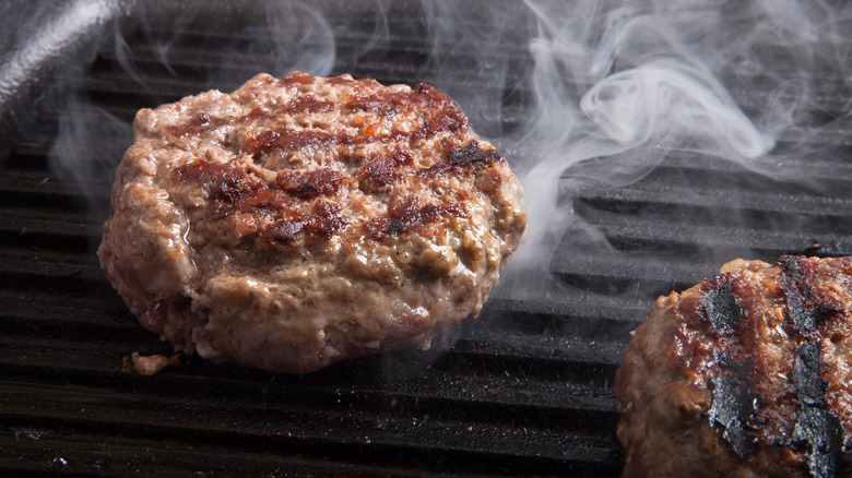 Burgers frying on a skillet