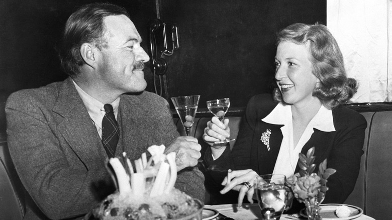 Ernest Hemingway drinking with Martha Gellhorn