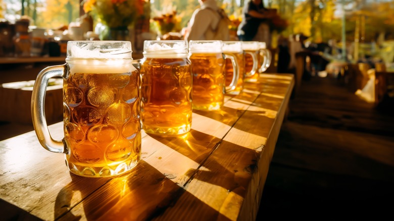 row of beer steins on table