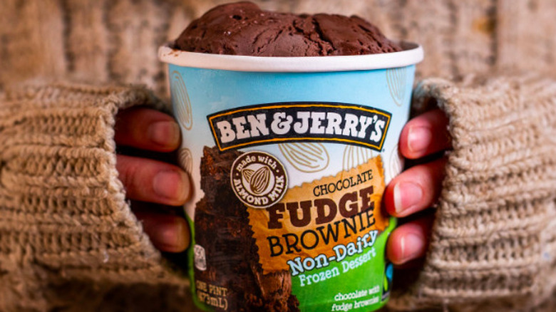 Hands holding Chocolate Fudge Brownie pint