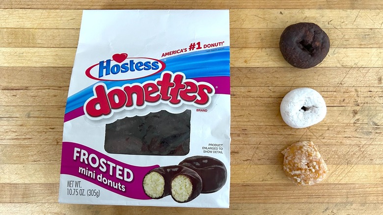 Bag and individual powdered, frosted, and crunch Donettes