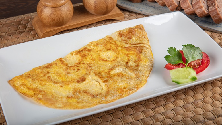 omelet on plate with salad