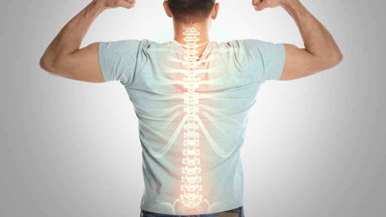 back of man with spine showing strength