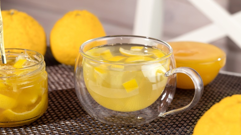 yuzu tea in glass with whole fruit