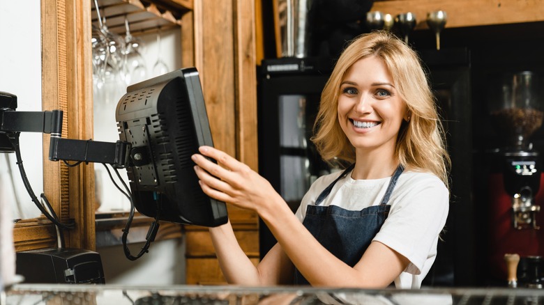 Happy woman working at restaurant