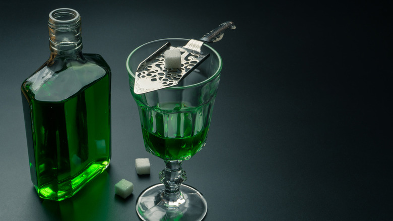 Absinthe in glass and bottle